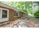 Exterior of brick home with charming front entry and garden beds at 316 Anne Ave, Waxhaw, NC 28173