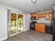 Kitchen with sleek appliances, and sliding door access to a screened patio for outdoor enjoyment at 316 Anne Ave, Waxhaw, NC 28173