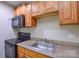 Close-up of the kitchen features a range and microwave for culinary convenience at 316 Anne Ave, Waxhaw, NC 28173
