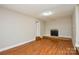 Cozy living room with hardwood floors and a non-working fireplace, creating a warm ambiance at 316 Anne Ave, Waxhaw, NC 28173