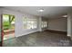 An open living room with recently installed vinyl flooring and natural light at 316 Anne Ave, Waxhaw, NC 28173