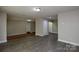 Open concept living space with laminate flooring and neutral paint at 316 Anne Ave, Waxhaw, NC 28173
