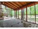 The screened porch overlooks a private, tree-filled backyard at 316 Anne Ave, Waxhaw, NC 28173