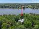 Aerial view of home nestled amongst the trees and near the lake at 3165 Laurel Ridge Nw Rd, Hickory, NC 28601