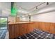 Finished basement featuring a bar area and access to an outdoor patio at 3165 Laurel Ridge Nw Rd, Hickory, NC 28601