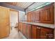 Bathroom featuring wooden cabinets with marble countertop and view to the outside at 3165 Laurel Ridge Nw Rd, Hickory, NC 28601
