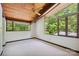 Comfortable bedroom featuring wood ceiling, large windows with backyard view at 3165 Laurel Ridge Nw Rd, Hickory, NC 28601