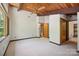 Bright bedroom featuring ceiling fan, large windows, and ensuite bathroom at 3165 Laurel Ridge Nw Rd, Hickory, NC 28601