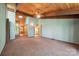Bedroom with hardwood ceilings, soft blue walls, carpet floors, and a window overlooking the backyard at 3165 Laurel Ridge Nw Rd, Hickory, NC 28601