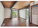 Bedroom featuring hardwood floors, wood ceilings, and large windows with outside views at 3165 Laurel Ridge Nw Rd, Hickory, NC 28601