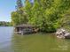 Charming covered boathouse with lounging area on a tranquil lake setting at 3165 Laurel Ridge Nw Rd, Hickory, NC 28601