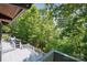 Expansive deck surrounded by lush greenery and trees offering a relaxing outdoor space at 3165 Laurel Ridge Nw Rd, Hickory, NC 28601