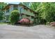 Stunning two-story home featuring unique architectural details and beautifully landscaped front yard at 3165 Laurel Ridge Nw Rd, Hickory, NC 28601