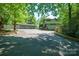 Exterior shot of home and three-car garage with well-maintained landscaping and long driveway at 3165 Laurel Ridge Nw Rd, Hickory, NC 28601