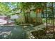 Attractive home exterior with stone accents, landscaped beds and mature trees providing privacy at 3165 Laurel Ridge Nw Rd, Hickory, NC 28601