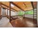 Upstairs hallway with hardwood floors, skylight, and wooden beams with views to the outside at 3165 Laurel Ridge Nw Rd, Hickory, NC 28601