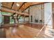 Open-concept living area highlighting vaulted ceilings, stone fireplace, and wood flooring at 3165 Laurel Ridge Nw Rd, Hickory, NC 28601