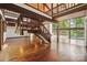 Spacious living room showcasing vaulted wood ceilings and staircase to the second level at 3165 Laurel Ridge Nw Rd, Hickory, NC 28601