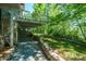 Beautiful stone patio with stone walls and a view of the backyard and lake at 3165 Laurel Ridge Nw Rd, Hickory, NC 28601
