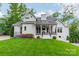 Attractive home exterior featuring a well-maintained lawn, charming porch, and beautiful landscaping at 331 Anthony Cir, Charlotte, NC 28211