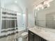 Clean bathroom with tub and shower, modern vanity, and neutral decor at 331 Anthony Cir, Charlotte, NC 28211