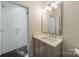Modern bathroom with a glass-enclosed shower, subway tile, and sleek fixtures at 331 Anthony Cir, Charlotte, NC 28211