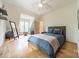 Bright bedroom featuring hardwood floors, a comfortable bed, and natural lighting at 331 Anthony Cir, Charlotte, NC 28211