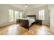Bright bedroom with hardwood floors, large windows, and comfortable furnishings at 331 Anthony Cir, Charlotte, NC 28211