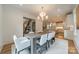 Dining room with a large table, modern chandelier, and open layout at 331 Anthony Cir, Charlotte, NC 28211