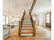 Grand entryway featuring a staircase, hardwood floors, and modern chandeliers at 331 Anthony Cir, Charlotte, NC 28211