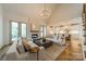 Spacious living room boasts a stone fireplace, hardwood floors, and a view to the gourmet kitchen beyond at 331 Anthony Cir, Charlotte, NC 28211