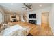 Open-concept living room with hardwood floors, modern furnishings, and large flat-screen TV for entertainment at 331 Anthony Cir, Charlotte, NC 28211