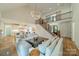 Open-concept living room showcases a staircase, kitchen access, and natural light at 331 Anthony Cir, Charlotte, NC 28211