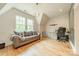 Cozy living room space with comfortable seating, a desk, and a large window at 331 Anthony Cir, Charlotte, NC 28211