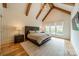 Spacious main bedroom boasts hardwood floors, vaulted ceilings with wood beams, and an abundance of natural light at 331 Anthony Cir, Charlotte, NC 28211