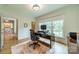 Bright and airy home office with large windows and a comfortable workspace at 331 Anthony Cir, Charlotte, NC 28211