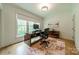Bright office space with a large window view, modern desk, and light wood flooring at 331 Anthony Cir, Charlotte, NC 28211