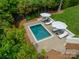 Aerial view of a private pool surrounded by lush greenery and comfortable lounge areas at 331 Anthony Cir, Charlotte, NC 28211
