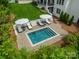 Aerial view of a private pool surrounded by lush greenery and comfortable lounge areas at 331 Anthony Cir, Charlotte, NC 28211