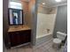 Well-lit bathroom featuring a vanity with dark wood cabinetry and a shower-tub combination at 4194 Buffalo Shoals Rd, Maiden, NC 28650