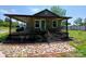 Charming stone cottage with a covered porch and decorative stone walkway at 4194 Buffalo Shoals Rd, Maiden, NC 28650