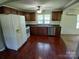 Well-lit kitchen featuring wood cabinets, a double sink, and modern appliances at 4194 Buffalo Shoals Rd, Maiden, NC 28650