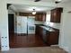 Well-lit kitchen featuring wood cabinets, a double sink, and modern appliances at 4194 Buffalo Shoals Rd, Maiden, NC 28650