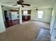 Open-concept floor plan connecting the living room and kitchen with hardwood floors at 4194 Buffalo Shoals Rd, Maiden, NC 28650