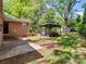 Backyard features a patio, gazebo, and storage shed, offering outdoor living and storage options at 500 Colony Acres Dr, Charlotte, NC 28217