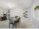 Inviting dining area with a wooden table, stylish decor, and tile flooring at 500 Colony Acres Dr, Charlotte, NC 28217