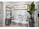 Cozy entryway with bench seating, coat rack, and a decorative 'Welcome' sign at 500 Colony Acres Dr, Charlotte, NC 28217
