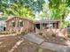 Charming brick home with covered front porch, manicured landscaping, and inviting curb appeal at 500 Colony Acres Dr, Charlotte, NC 28217