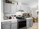 Efficient kitchen featuring modern appliances, ample counter space, and gray cabinetry at 500 Colony Acres Dr, Charlotte, NC 28217