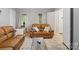 Inviting living room with neutral walls, comfortable seating, and bright natural light at 500 Colony Acres Dr, Charlotte, NC 28217